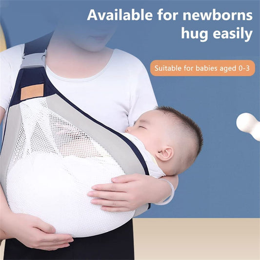 Close-up of a mother wearing a gray breathable cotton baby carrier wrap while holding her newborn infant hands-free.