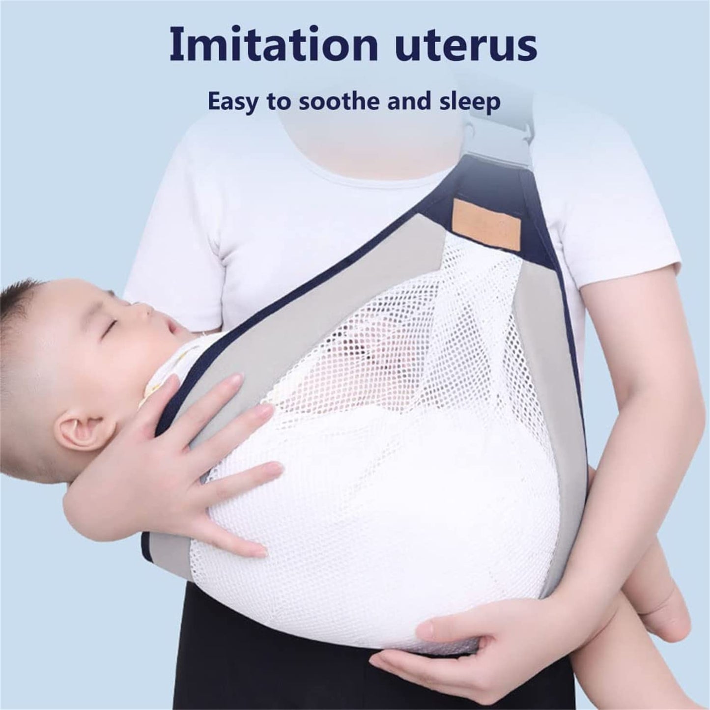 Close-up of a mother wearing a gray breathable cotton baby carrier wrap while holding her newborn infant hands-free.