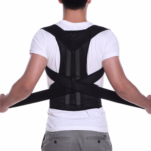 Close-up of a man wearing a black adjustable posture corrector belt over his t-shirt to fix rounded shoulders and hunchback.