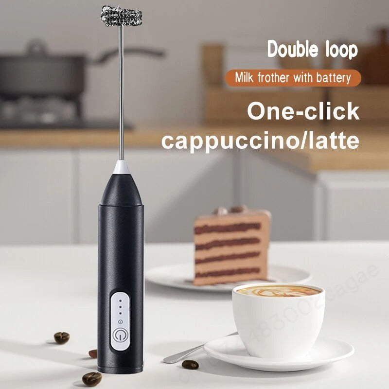 Close-up of a handheld electric milk frother whisking milk into a rich, creamy foam in a clear glass mug.